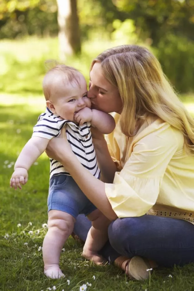 Young mother holding baby