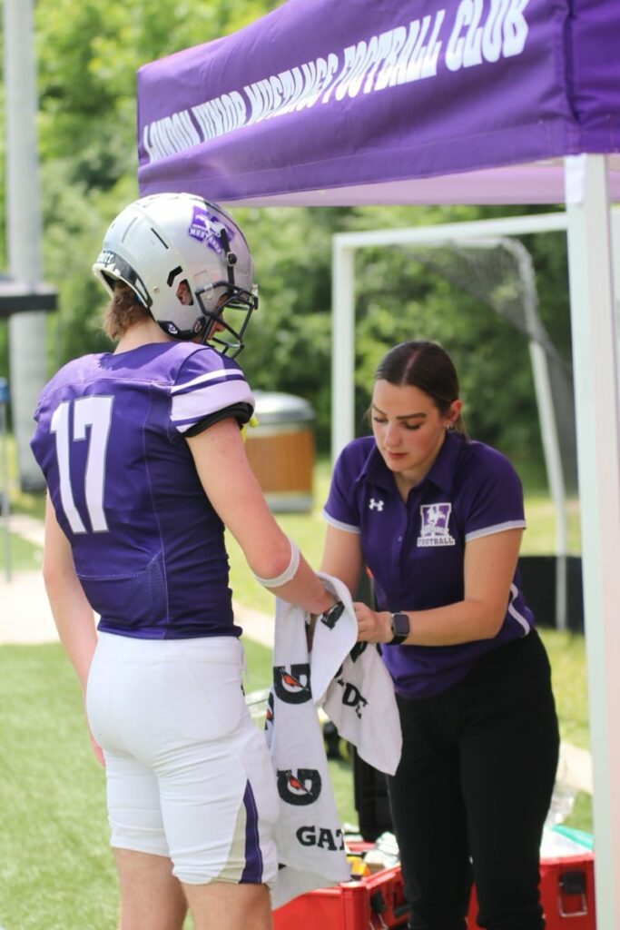 Athletic Therapy session on the sidelines with Western Mustangs